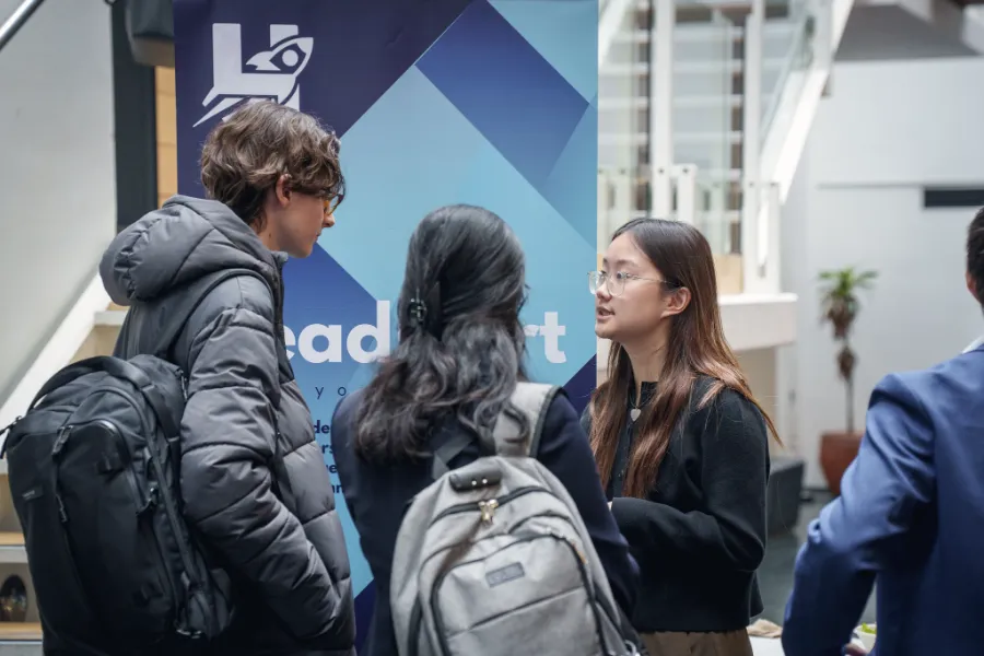 A student in conversation at a Headstart event