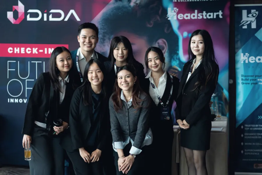 The Headstart team at a branded check-in desk